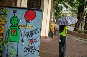 This graffiti image links robots, love, and control, echoing the article’s interest in how AI intimacy can feel both desirable and carefully managed. Photo by Zoshua Colah on Unsplash. Licensed under the Unsplash License.